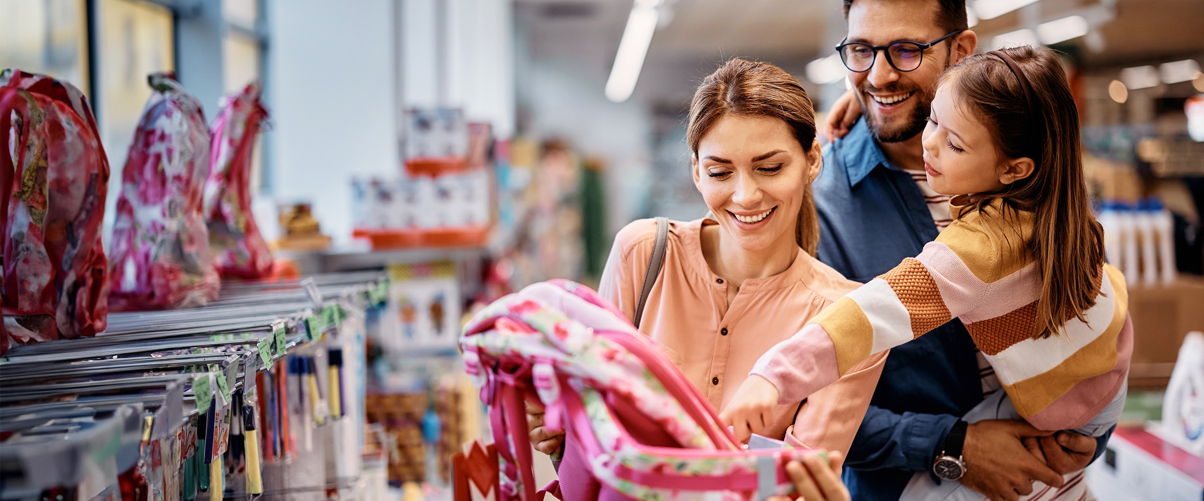 Photo of family shopping for school supplies.