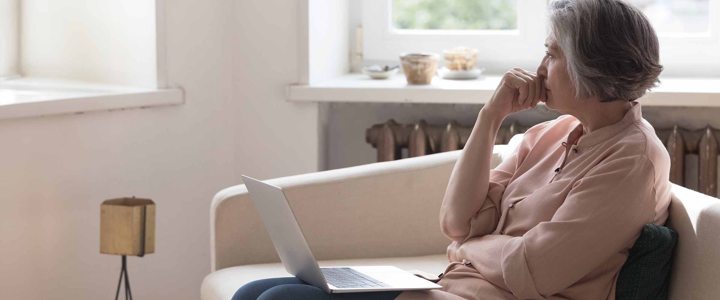 Photo of woman at laptop looking concerned.