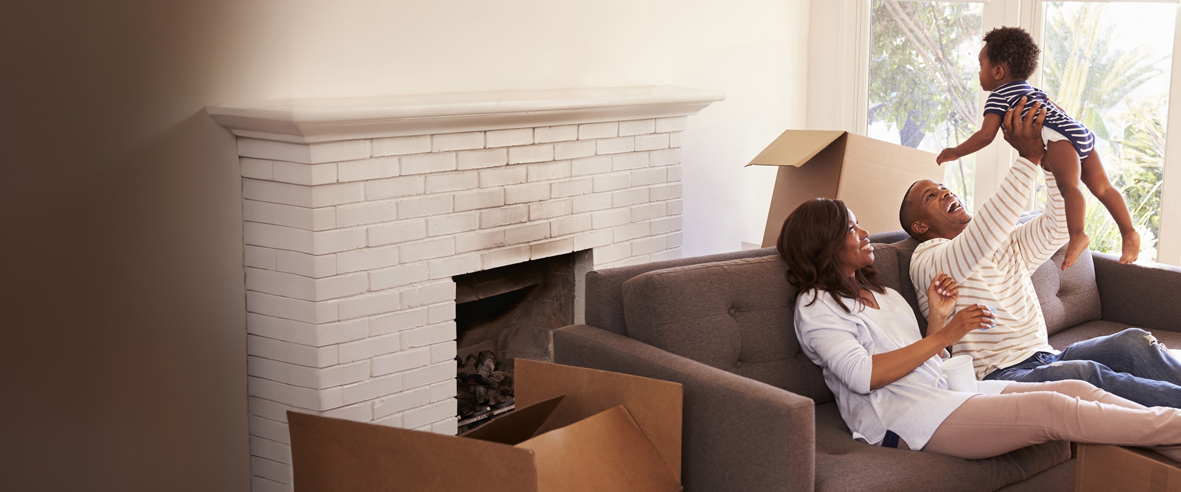 Photo of family playing on the couch.