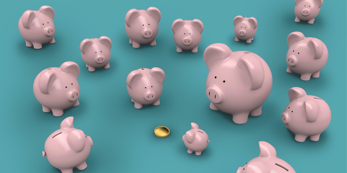 Different sized pink piggy banks staring at a coin.