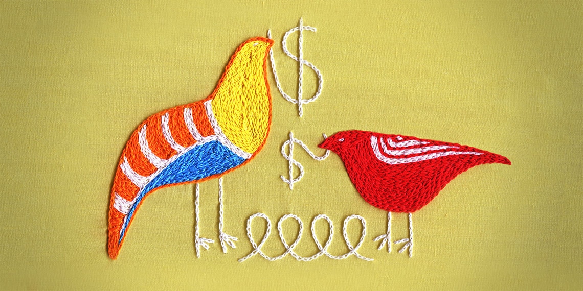 A needlepoint of two birds with a yarn in their beaks.