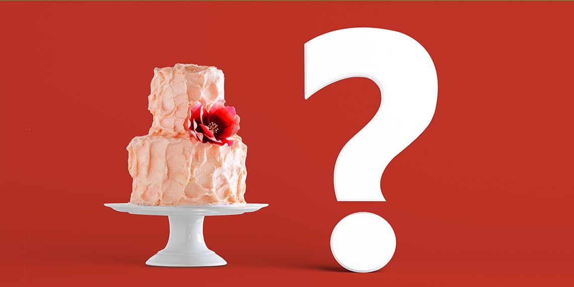 A wedding cake with a question mark.