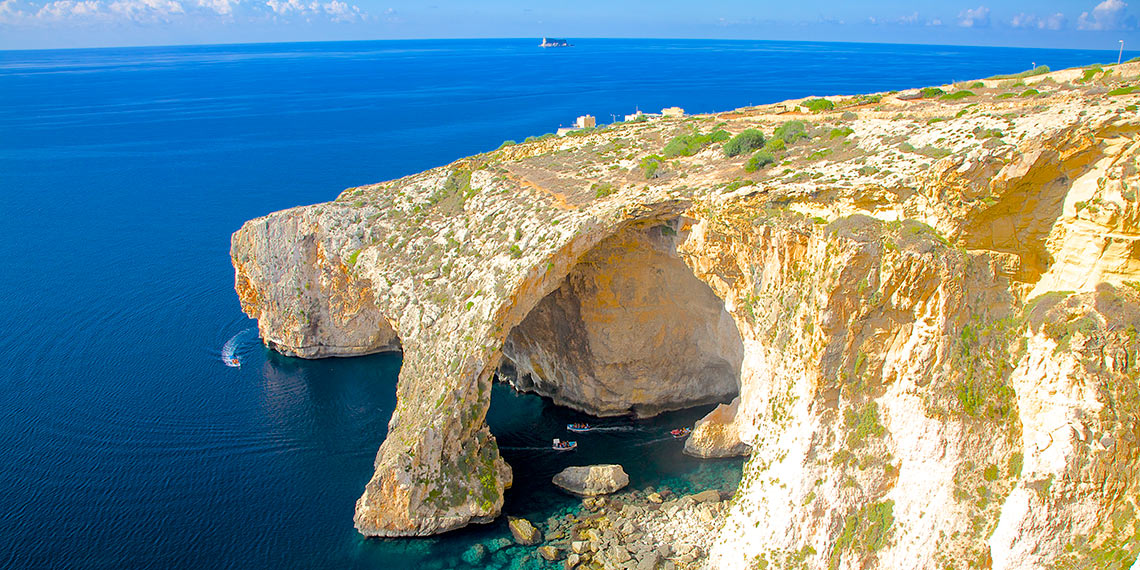 Boats visiting the Blue Grotto in Malta.