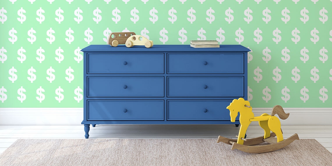 A dresser and rocking horse in front of wallpaper with dollar signs.