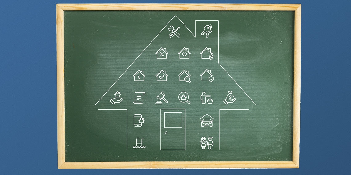 A blackboard with a house and calculations.